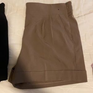Tan and black shorts